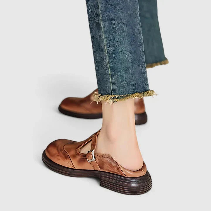 A woman wearing classic strap Mary Jane shoes on an elegant day out.