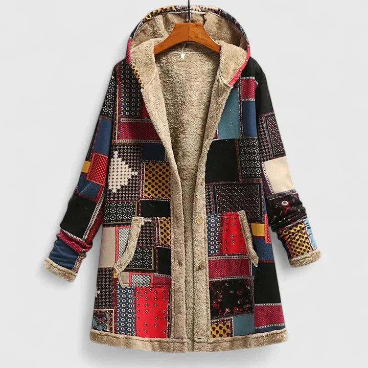 A cream hooded jacket with an all-over orange and green floral print and a soft lining.