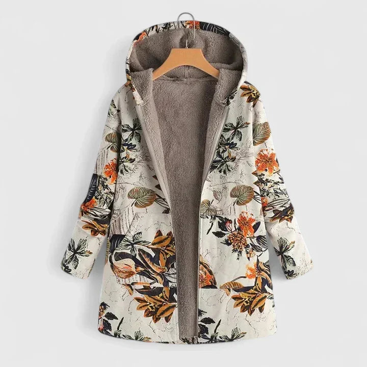 A cream hooded jacket with an all-over orange and green floral print and a soft lining.