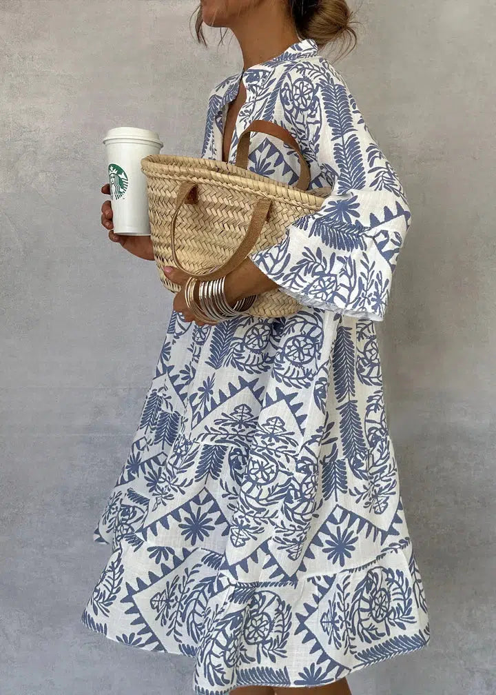 Woman wearing the Elaine button-front boho tunic dress, relaxed on a casual day out.
