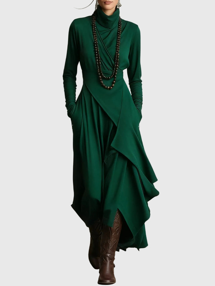 Woman wearing the Nancy draped high-neck maxi dress in violet with ankle boots.