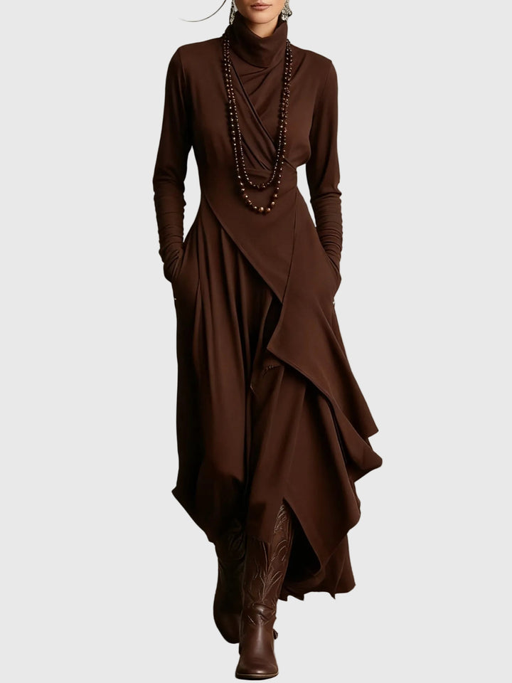 Woman wearing the Nancy draped high-neck maxi dress in violet with ankle boots.