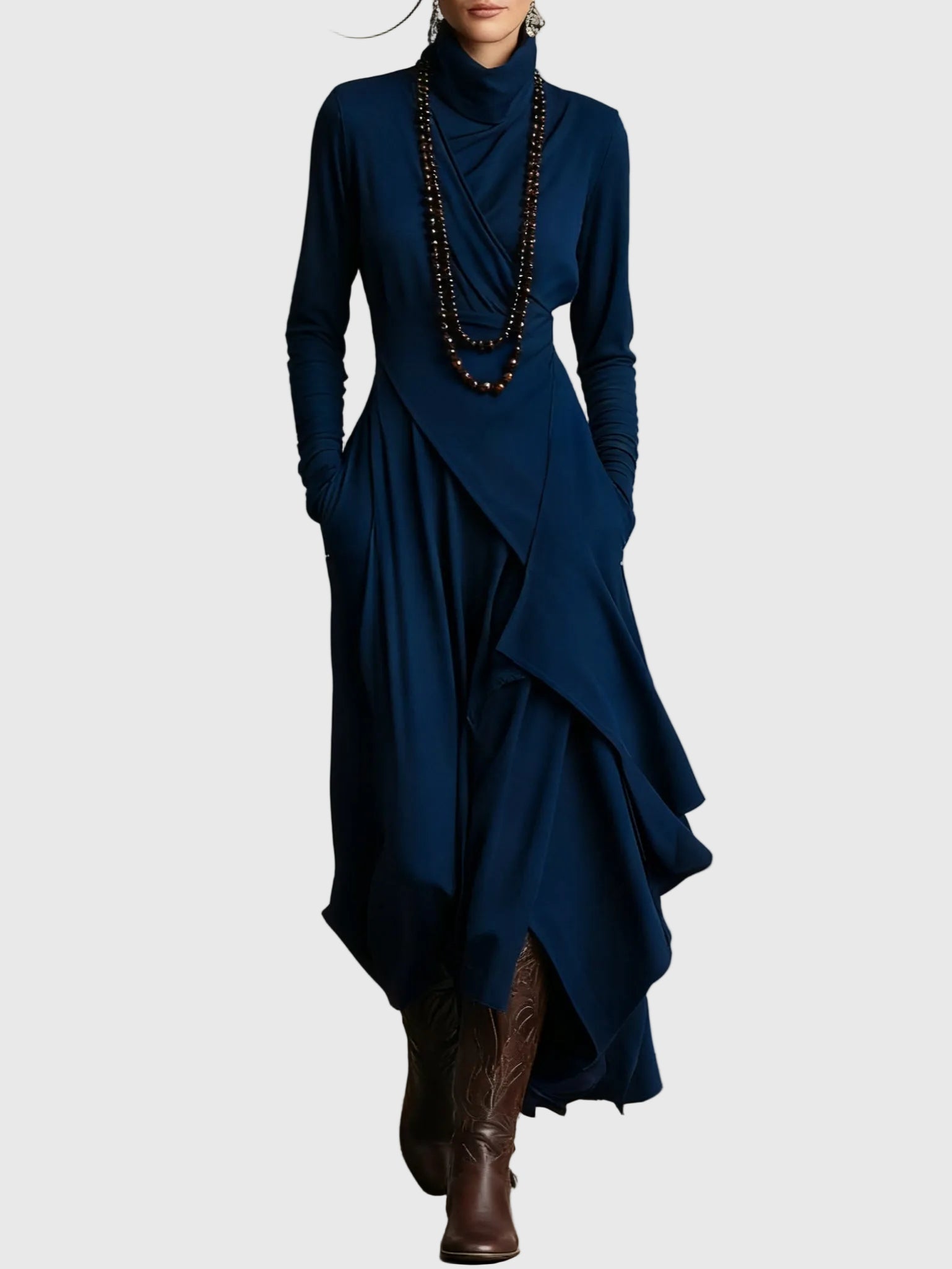 Woman wearing the Nancy draped high-neck maxi dress in violet with ankle boots.