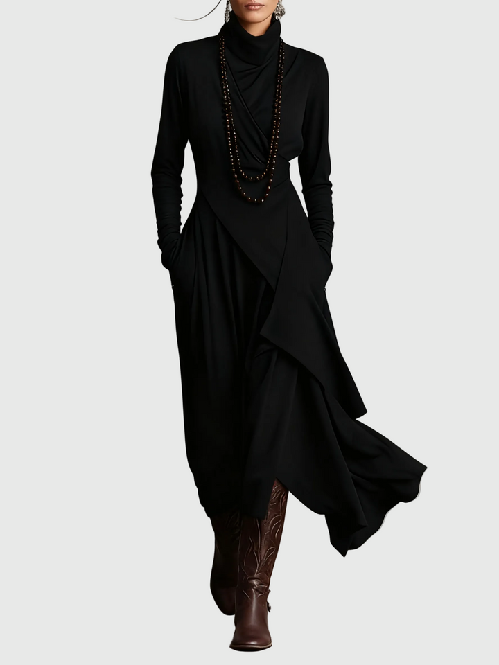 Woman wearing the Nancy draped high-neck maxi dress in violet with ankle boots.