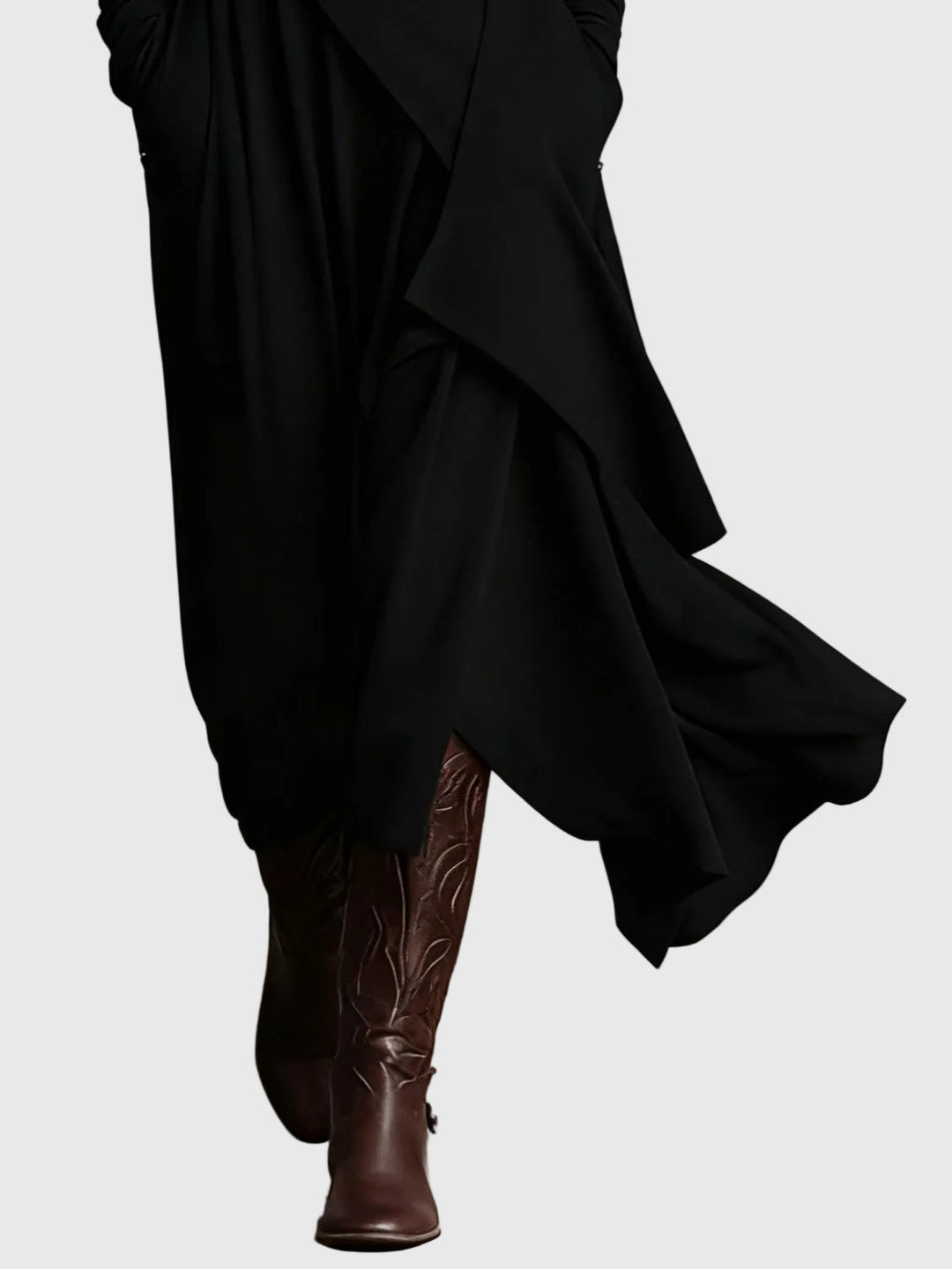 Woman wearing the Nancy draped high-neck maxi dress in violet with ankle boots.