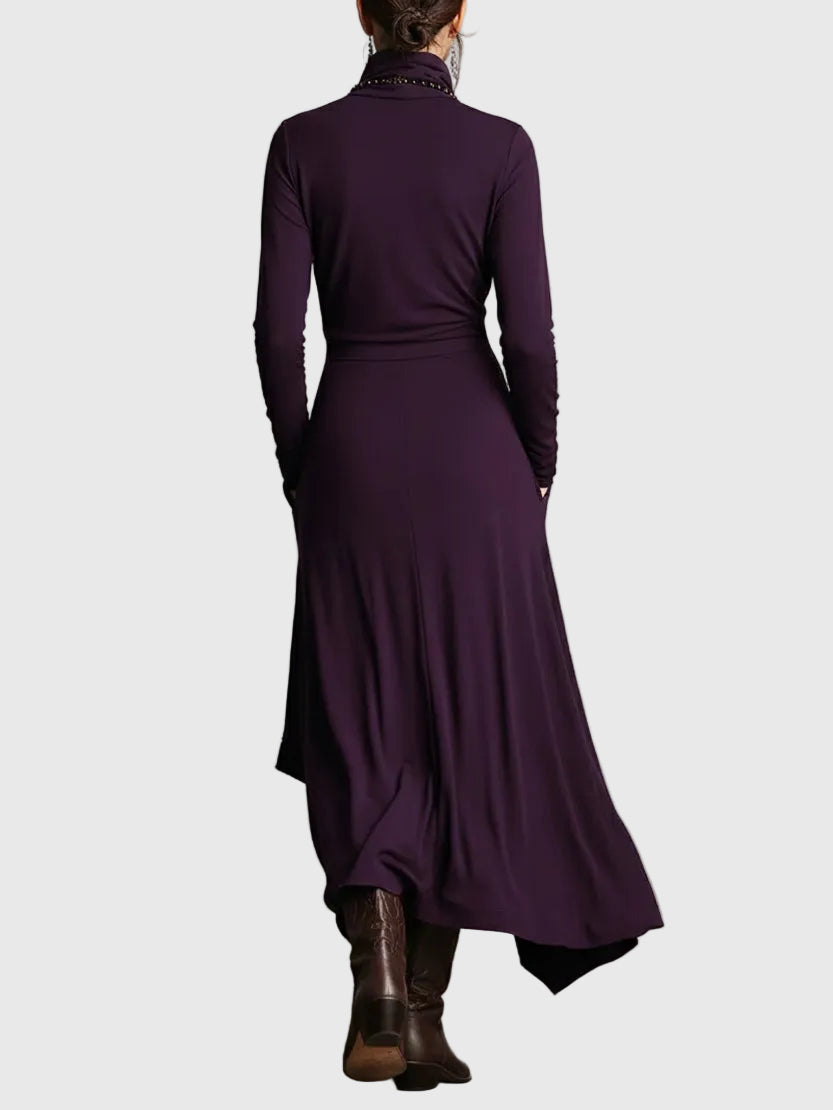 Woman wearing the Nancy draped high-neck maxi dress in violet with ankle boots.