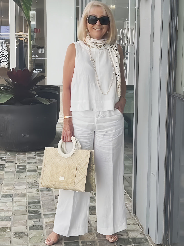 A woman wearing a chic minimal two-piece set with a soft, flattering silhouette.