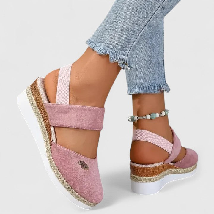 A woman in beige espadrille-inspired sandals stepping out comfortably on a bright morning.