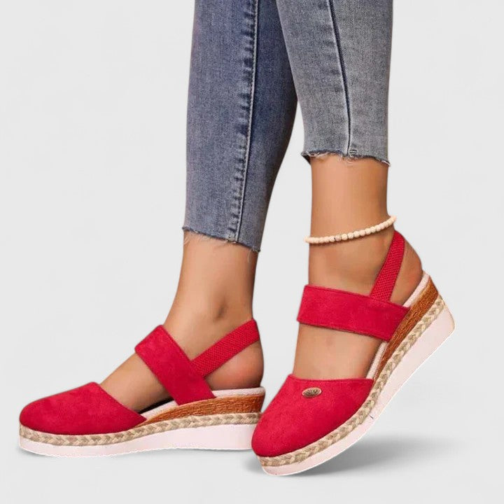 A woman in beige espadrille-inspired sandals stepping out comfortably on a bright morning.