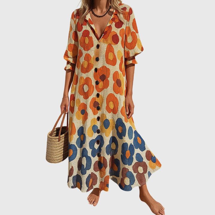 Woman wearing a romantic bohemian maxi dress with delicate patterns and a softly draped silhouette.