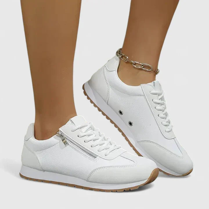 A woman wearing orthopaedic shoes with a supportive heel and a subtle lift