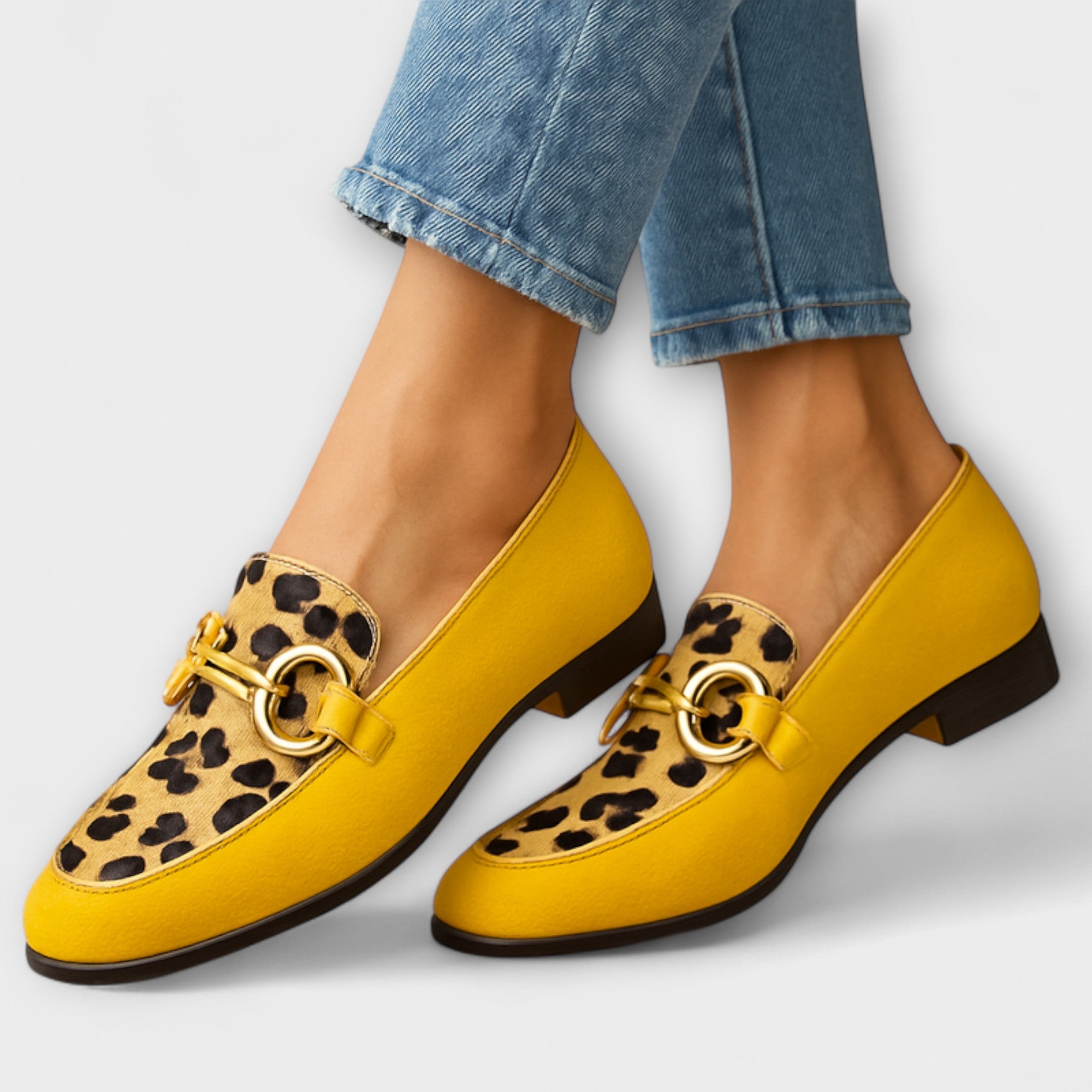 A woman wearing detailed slip-on loafers, finished with fine accents, on an everyday outing