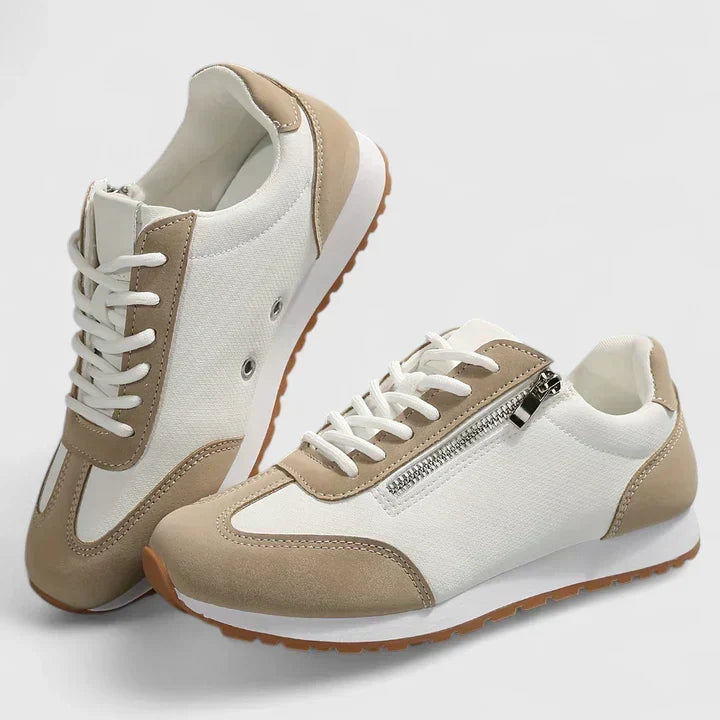 A woman wearing orthopaedic shoes with a supportive heel and a subtle lift