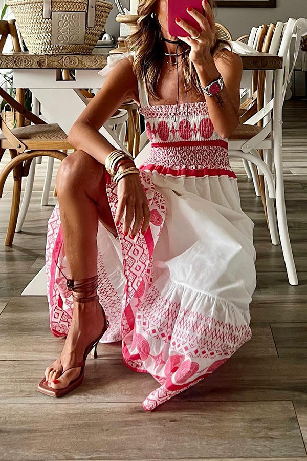 Woman wearing the Sara™ boho print maxi dress with a gathered bodice, enjoying a warm summer day outdoors.