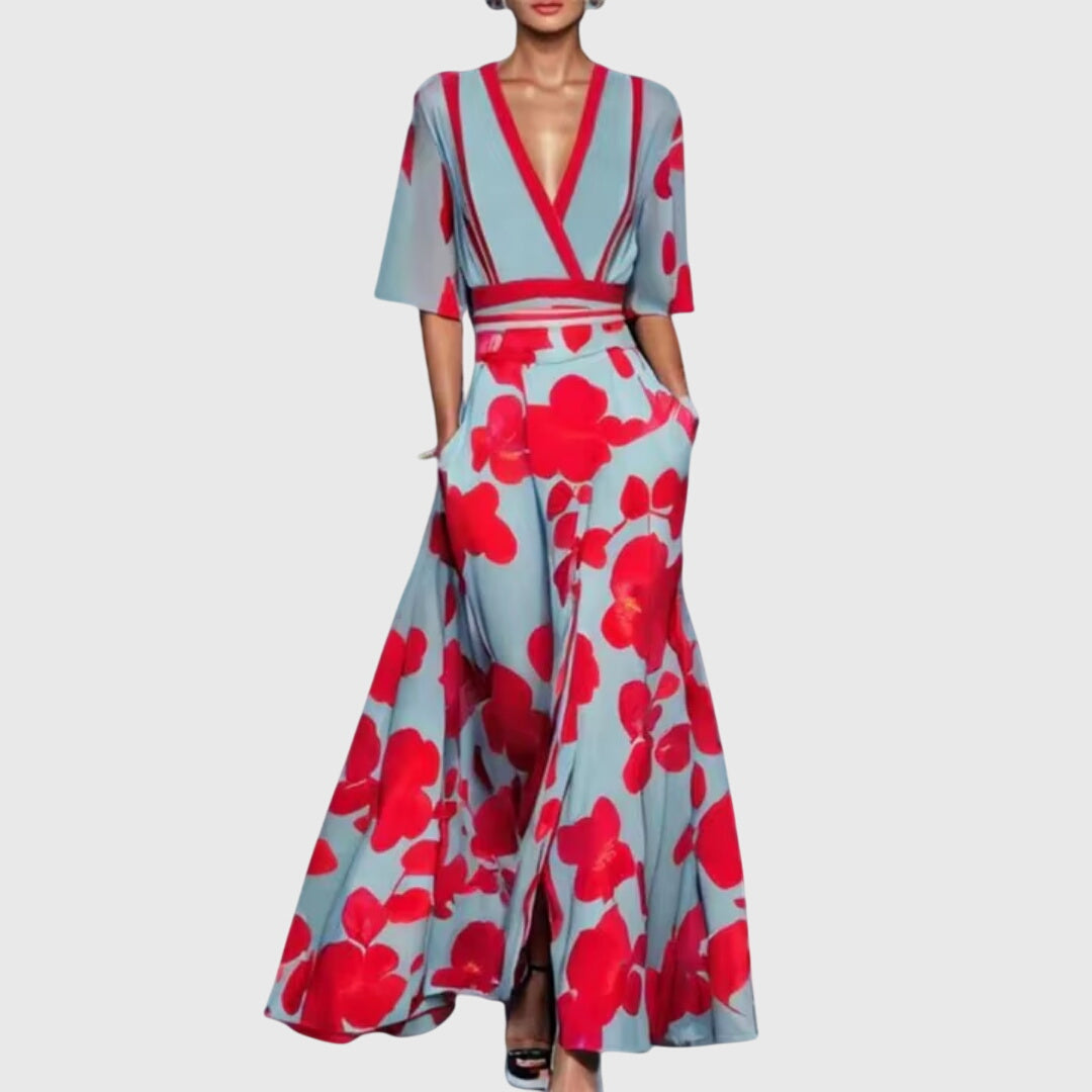Woman wearing a light floral spring dress with a defined waist and a softly swinging skirt.