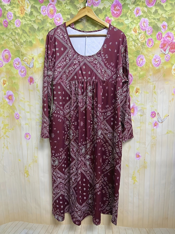A woman wearing the Maria long sleeve grey paisley midi dress with a square neckline and flowing skirt, styled for a relaxed day out.