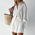 A woman wearing a classic button shirt with matching relaxed shorts, polished and easy.