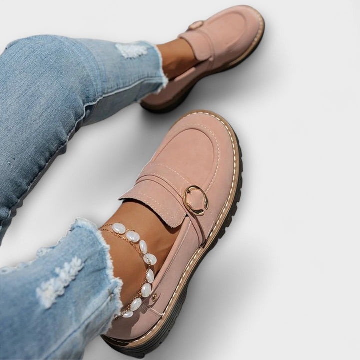 A woman wearing soft round-toe loafers with a casual everyday outfit