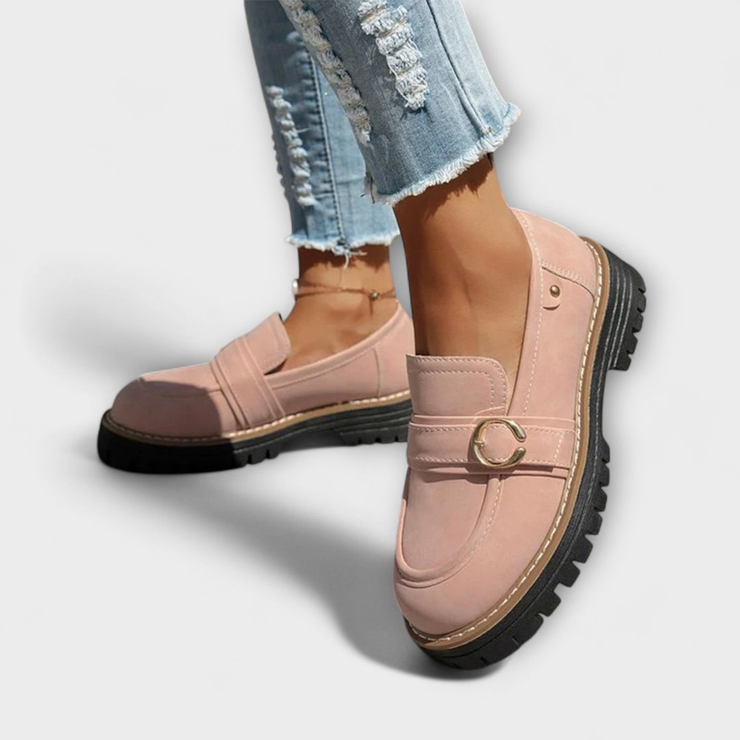 A woman wearing soft round-toe loafers with a casual everyday outfit