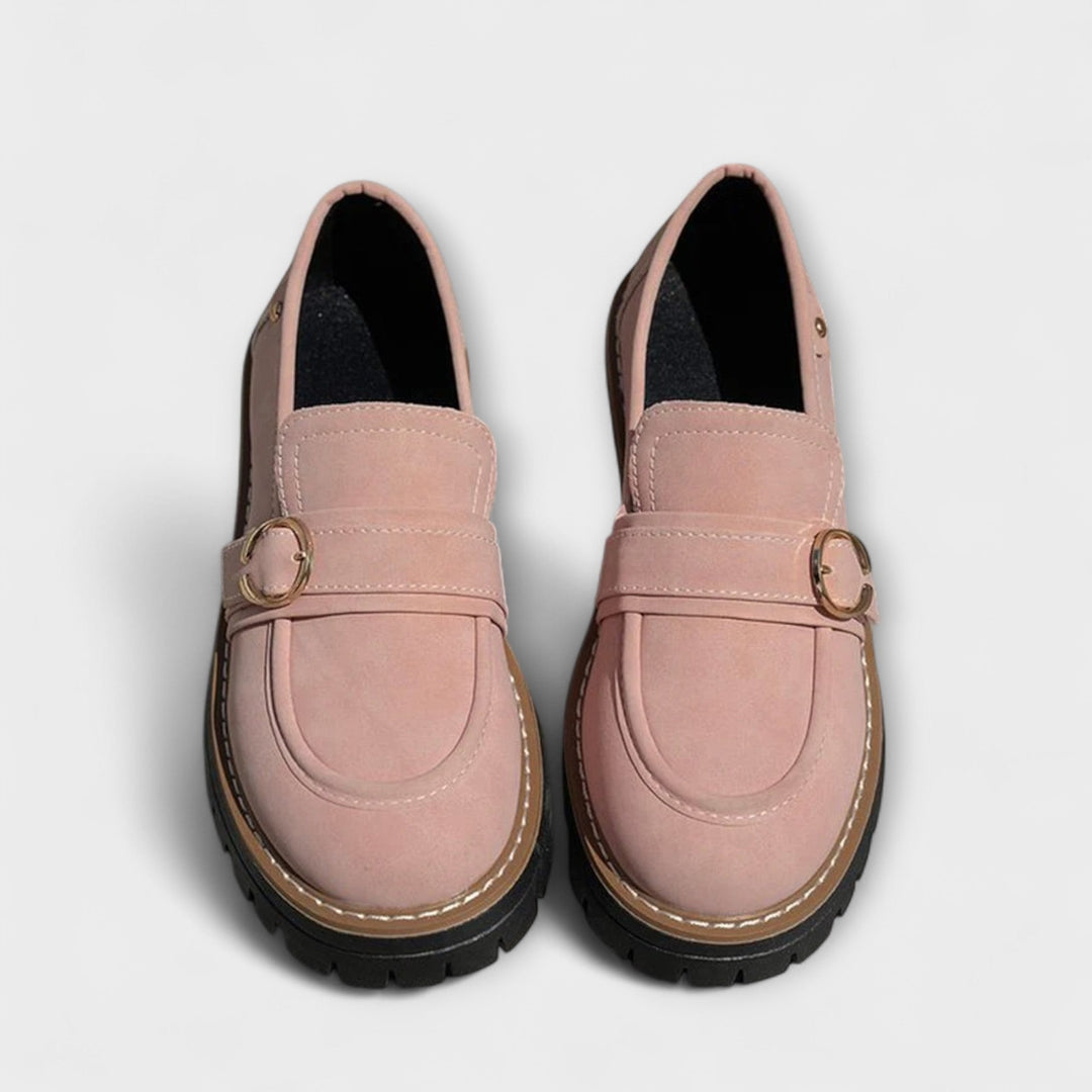 A woman wearing soft round-toe loafers with a casual everyday outfit