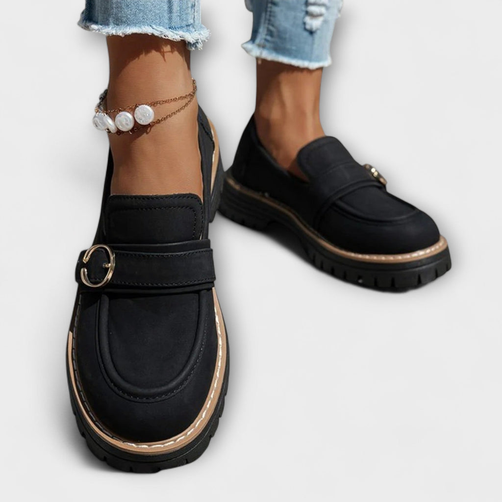 A woman wearing soft round-toe loafers with a casual everyday outfit