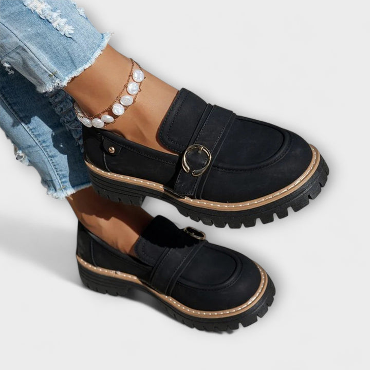 A woman wearing soft round-toe loafers with a casual everyday outfit