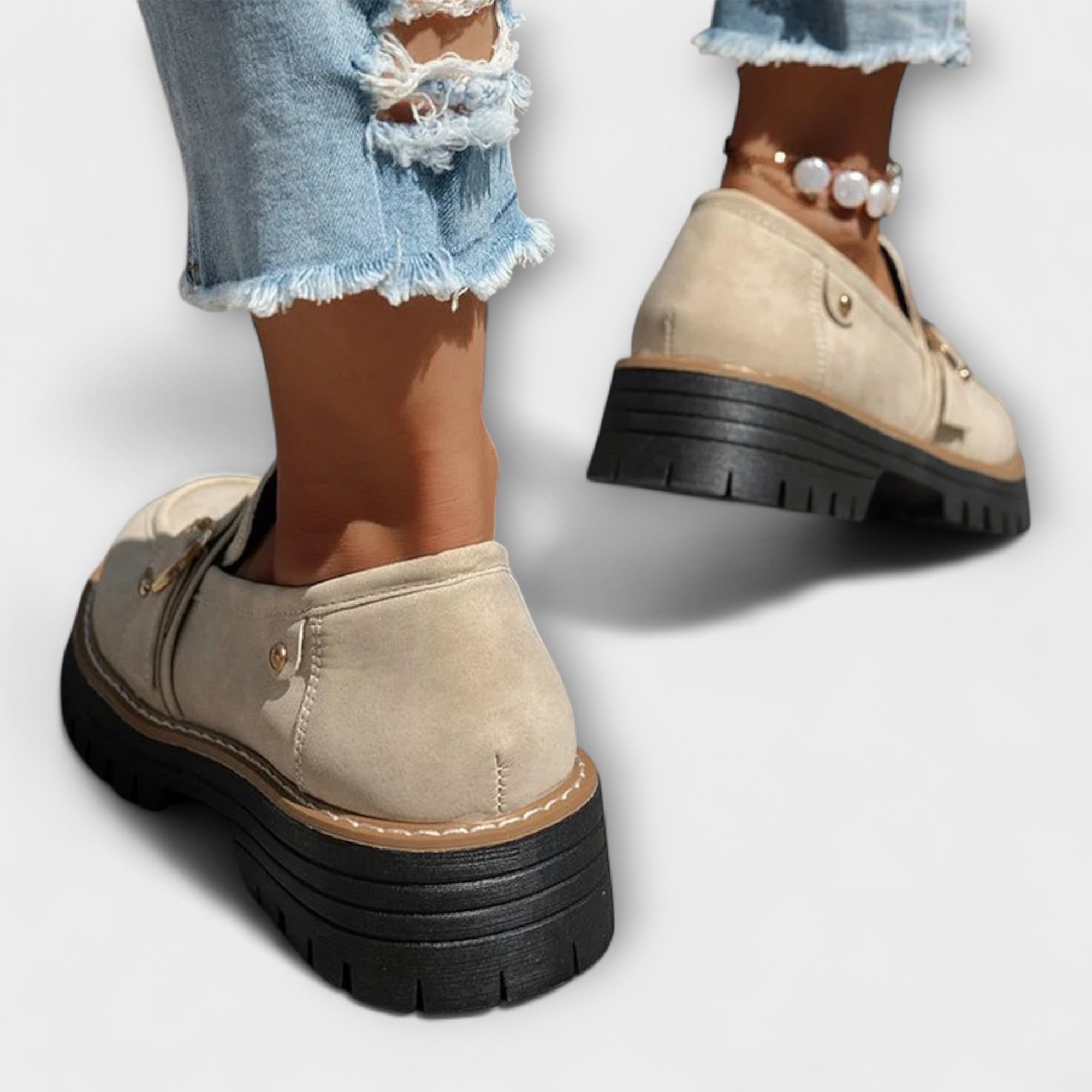 A woman wearing soft round-toe loafers with a casual everyday outfit