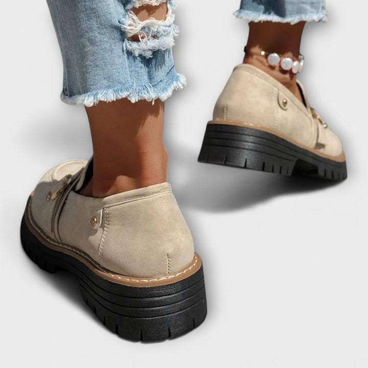 A woman wearing soft round-toe loafers with a casual everyday outfit
