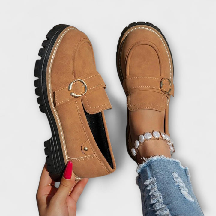 A woman wearing soft round-toe loafers with a casual everyday outfit