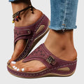 A woman in grey comfort flip-flops relaxing outdoors, feet cushioned and supported.