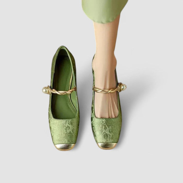 A woman wearing embellished green Mary Jane flats at a special occasion.