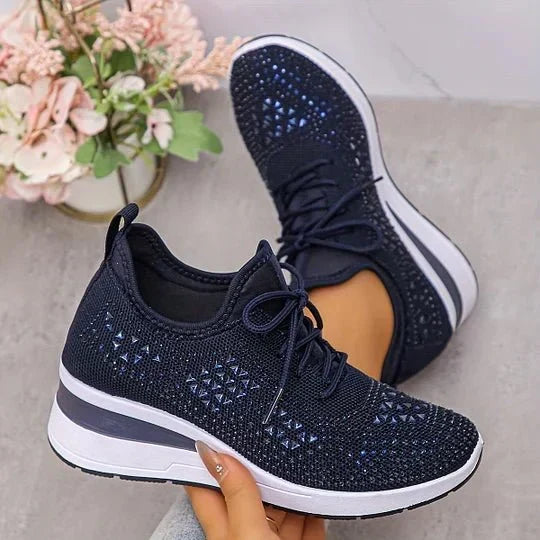 A woman walking comfortably outdoors in supportive everyday shoes.