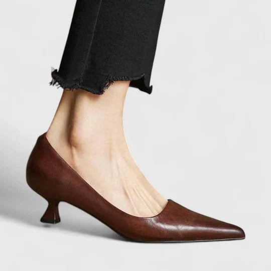 A woman in supportive everyday heels moving from the office to an evening event.