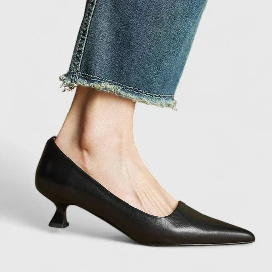 A woman in balanced comfort heels moving from the office to an evening reception.