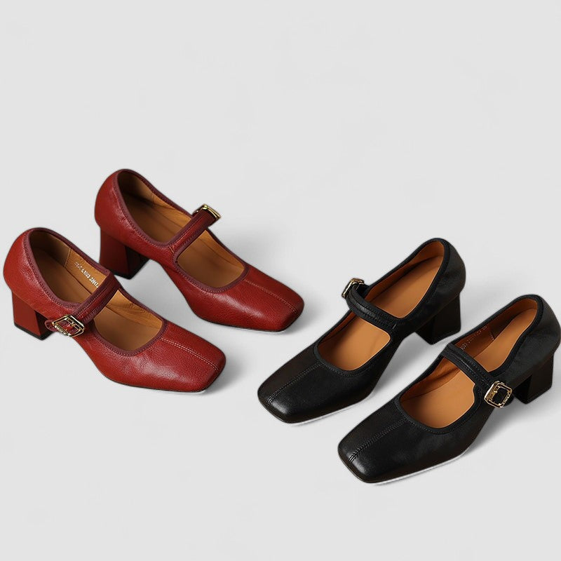 A woman in black Mary Jane shoes with a mid block heel, confident on an evening out.