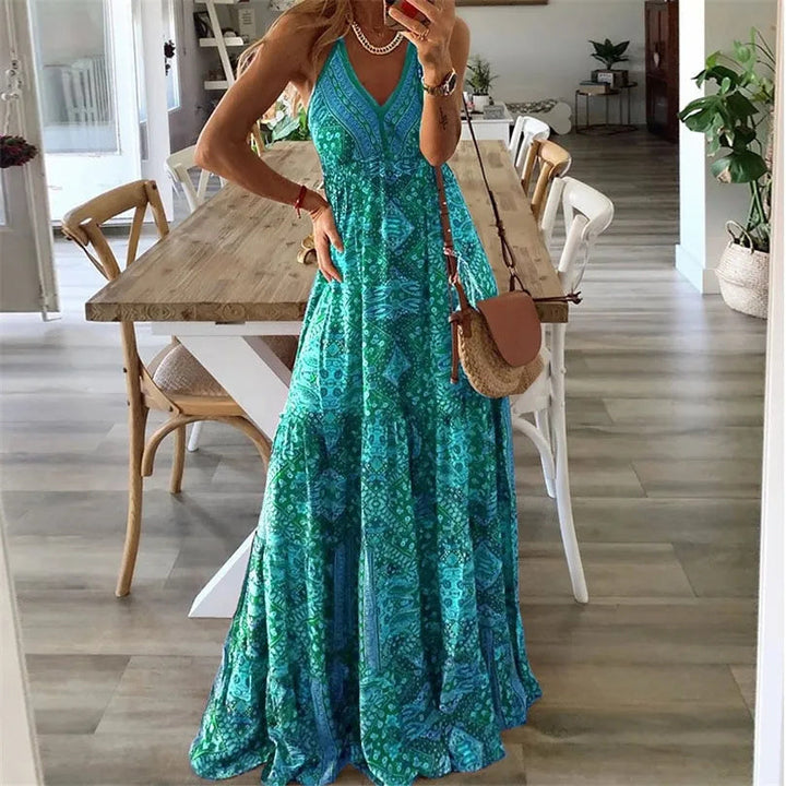 A woman wearing the Kelly sleeveless boho maxi dress with adjustable straps and a flowing tiered skirt.